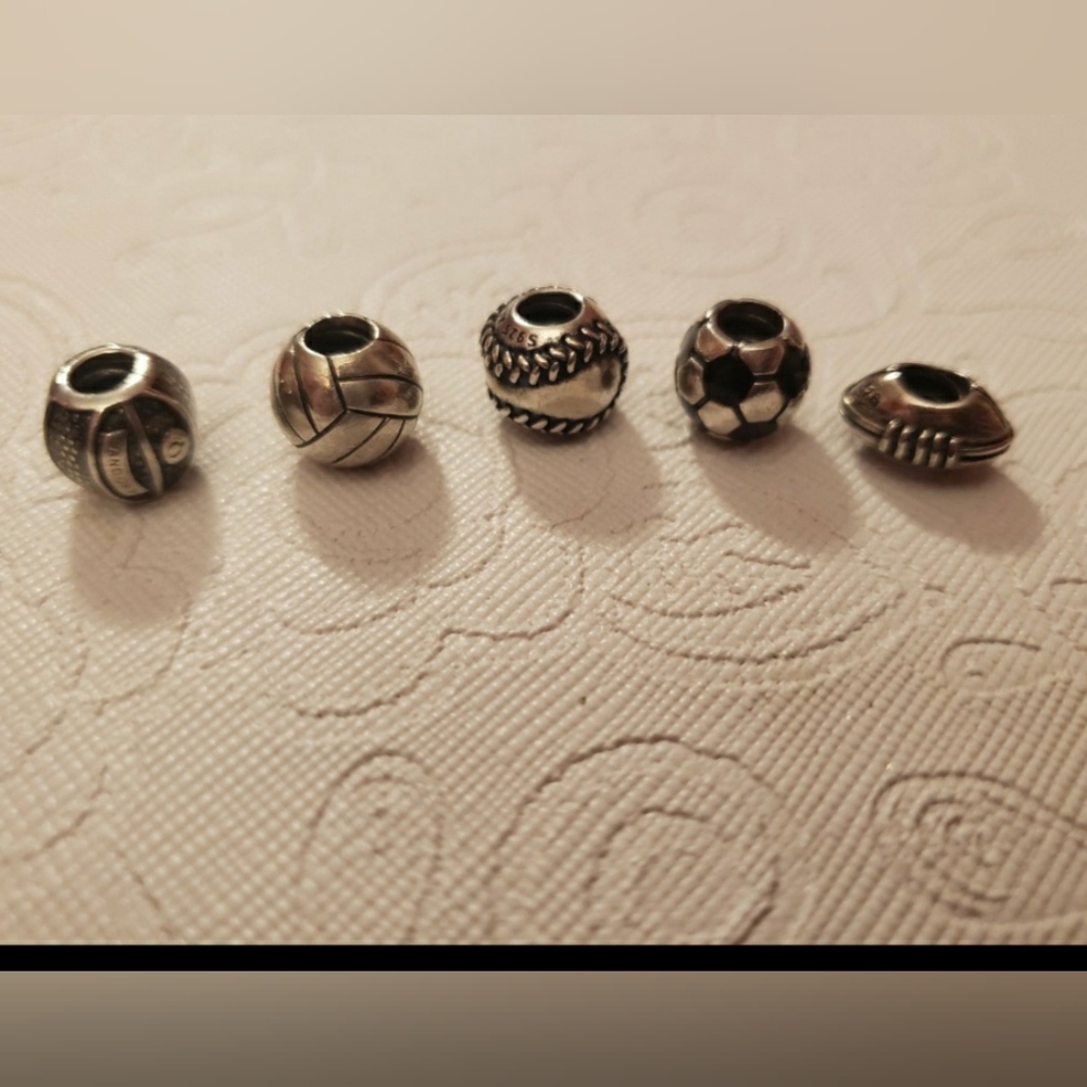 5 Pandora sports charms.